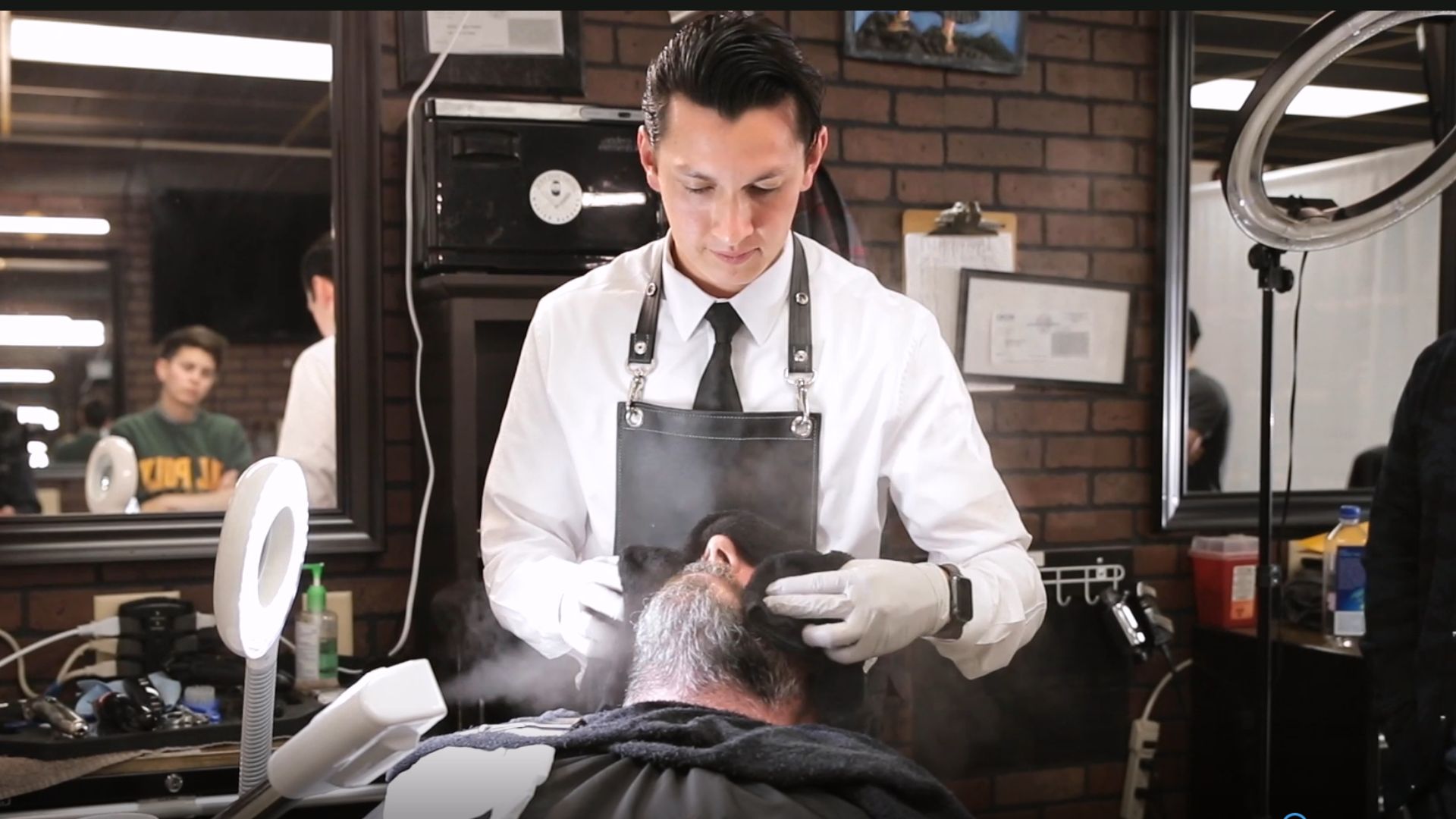 Master barber with a real client
